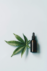 An image of a cannabis leaf with a small bottle