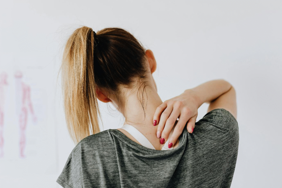 a woman touching her back