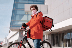 An image of a deliveryman wearing a face mask